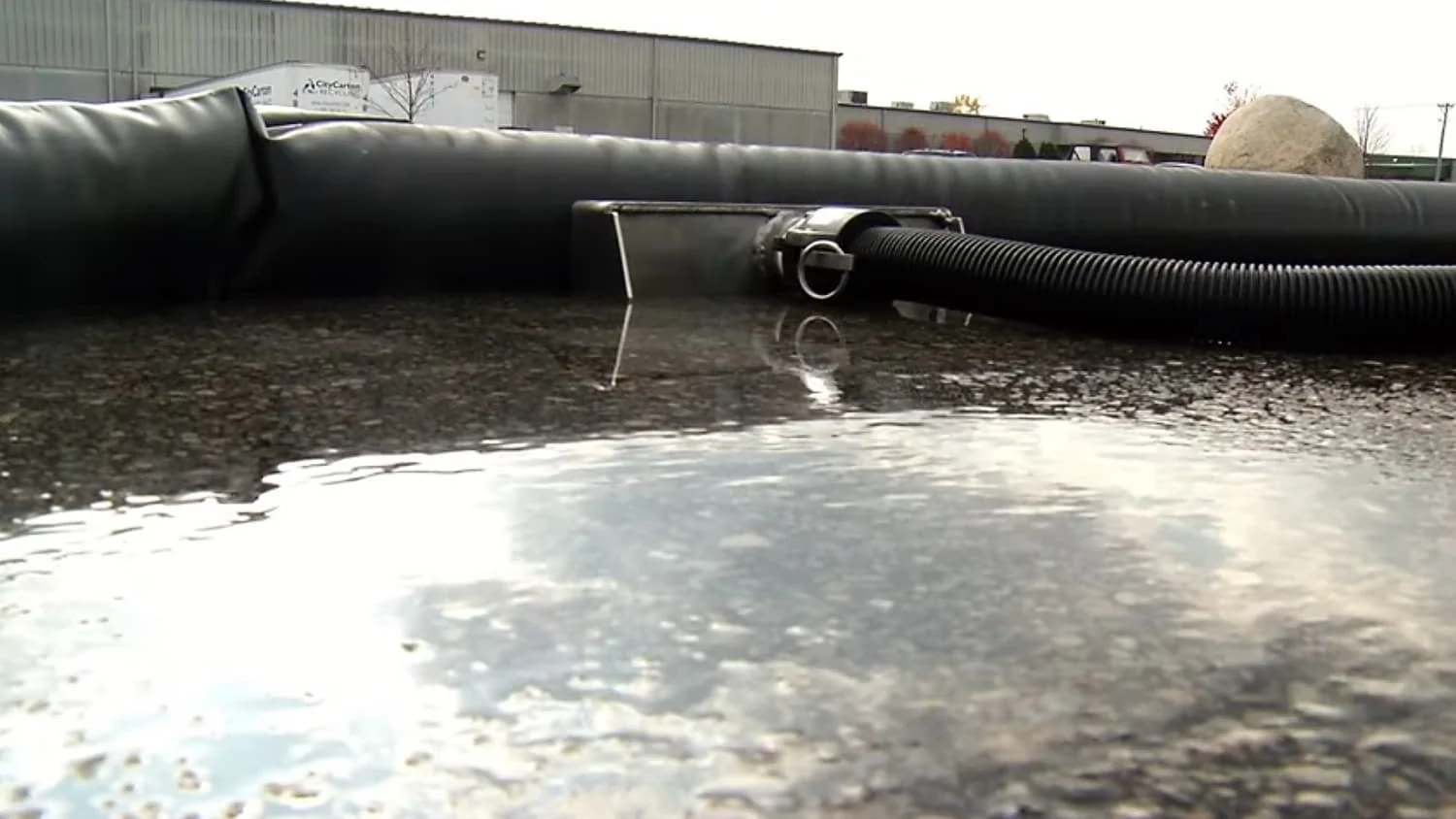 Wash water being recovered with a vacuum hose